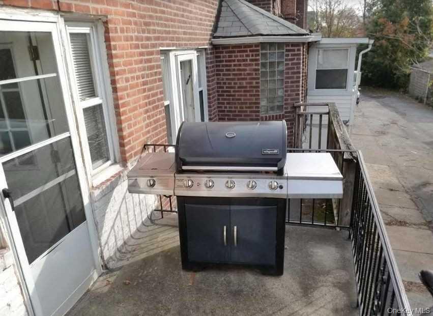 136-48 71st Road Queens, NY 11367 - Photo 13 of 13 a view of an house with backyard and kitchen