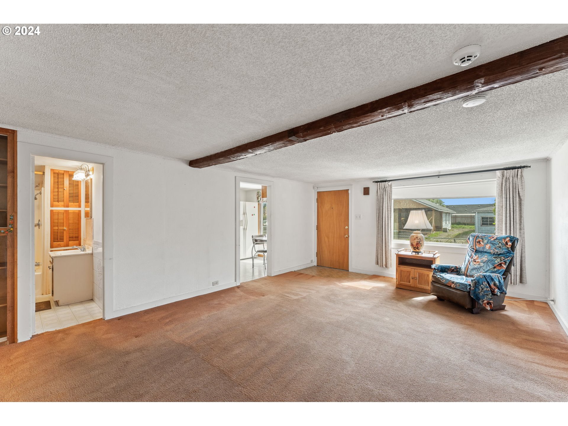 300 38th Street Springfield, OR 97478 - Photo 13 of 30 a living room with furniture and a large window