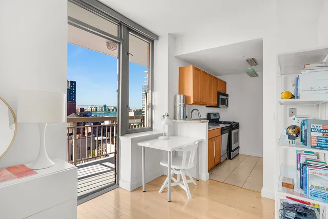a kitchen with stainless steel appliances granite countertop a refrigerator and a stove