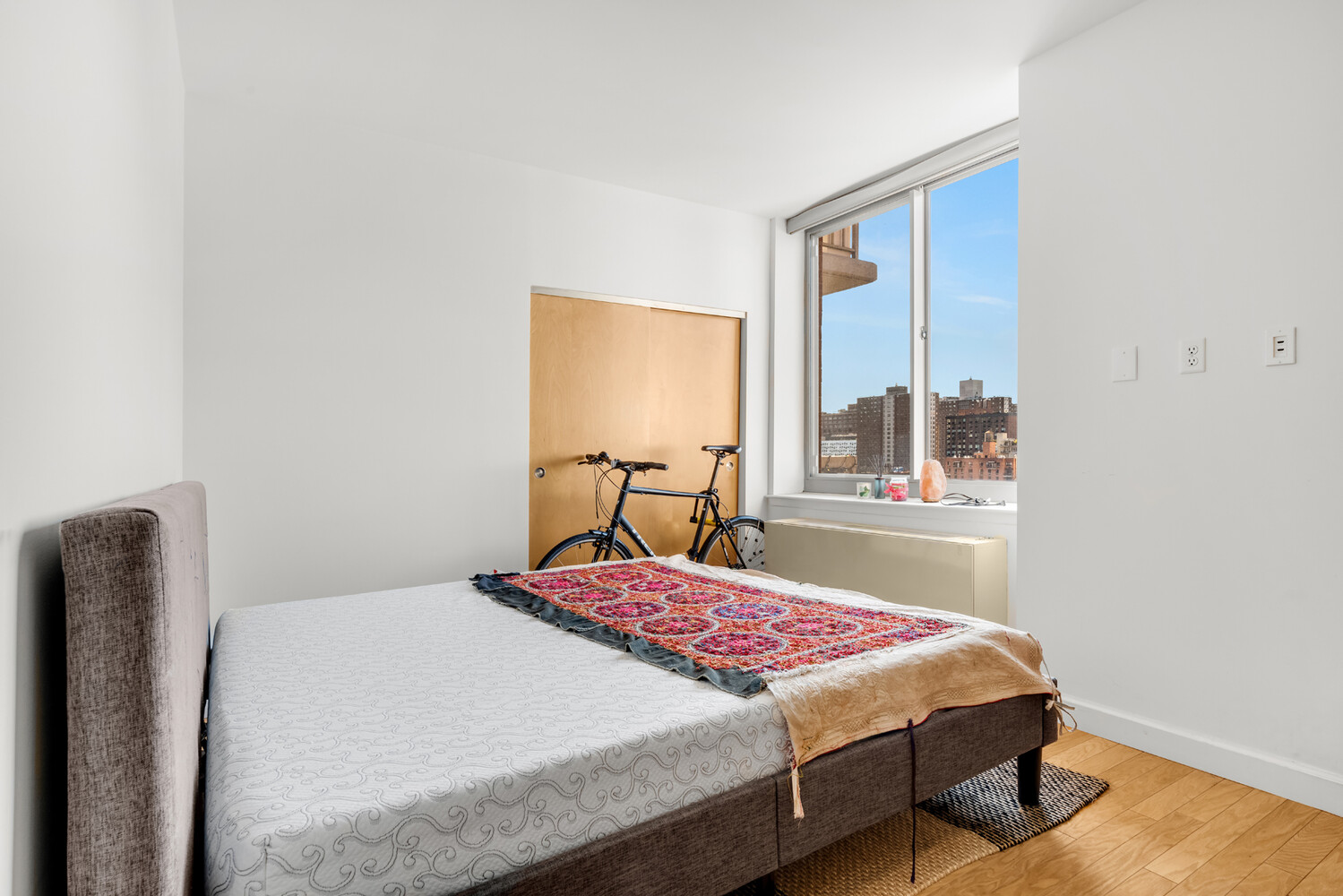 520 West 23rd Street, Unit 14G Manhattan, NY 10011 - Photo 5 of 7 a bedroom with a bed and window