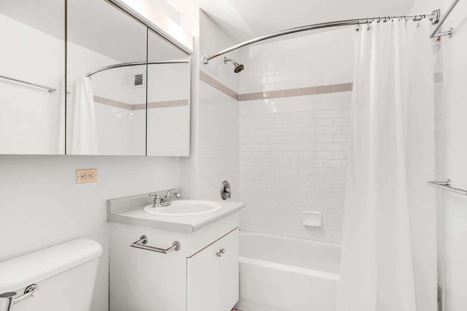 520 West 23rd Street, Unit 14G Manhattan, NY 10011 - Photo 6 of 7 a bathroom with a sink a vanity and a mirror
