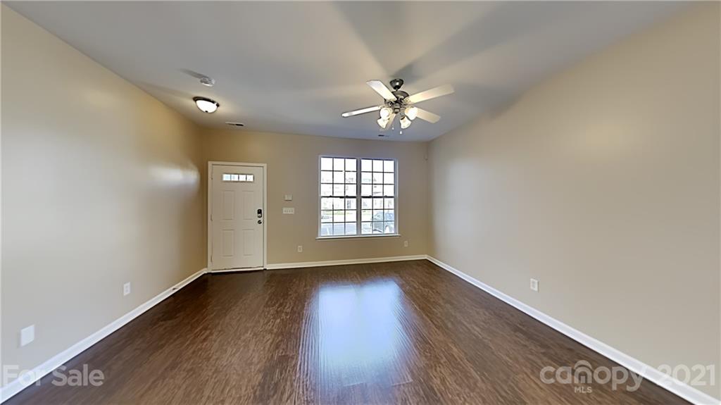 847 Gentlewinds Court Fort Mill, SC 29708 - Photo 2 of 13 wooden floor in an empty room with a window