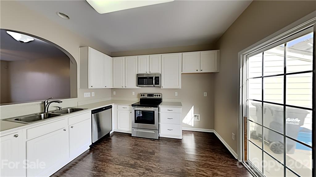 847 Gentlewinds Court Fort Mill, SC 29708 - Photo 5 of 13 a kitchen with stainless steel appliances granite countertop a stove a sink and a refrigerator