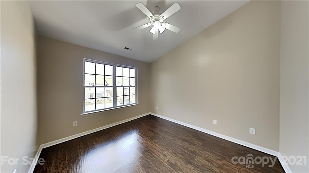 847 Gentlewinds Court Fort Mill, SC 29708 - Photo 8 of 13 an empty room with wooden floor and windows
