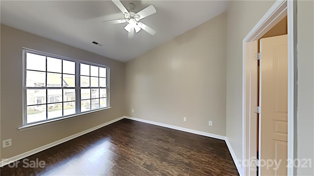847 Gentlewinds Court Fort Mill, SC 29708 - Photo 9 of 13 a view of empty room with wooden floor and fan