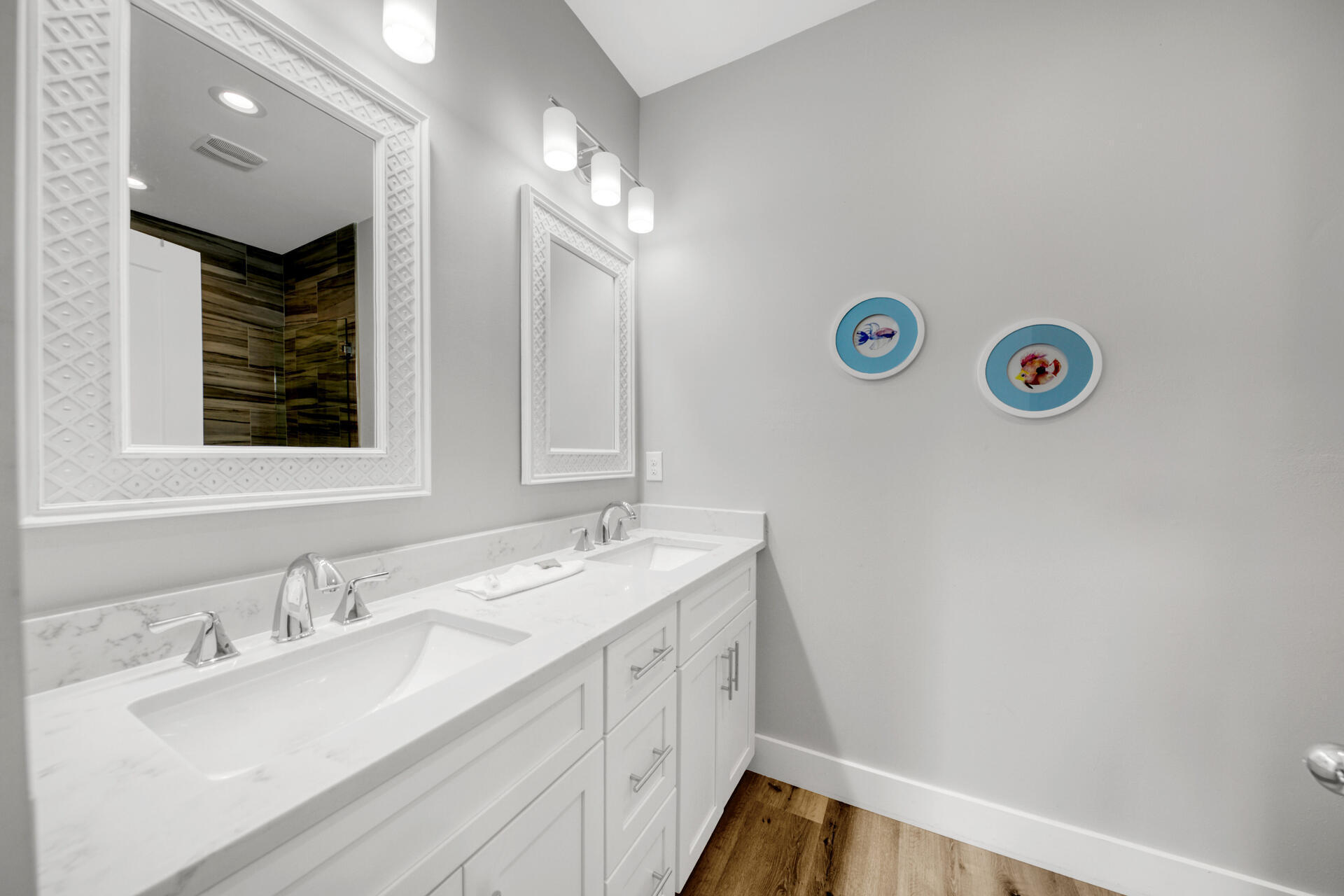 106 Shirah Street Destin, FL 32541 - Photo 15 of 67 a bathroom with a double vanity sink and a mirror