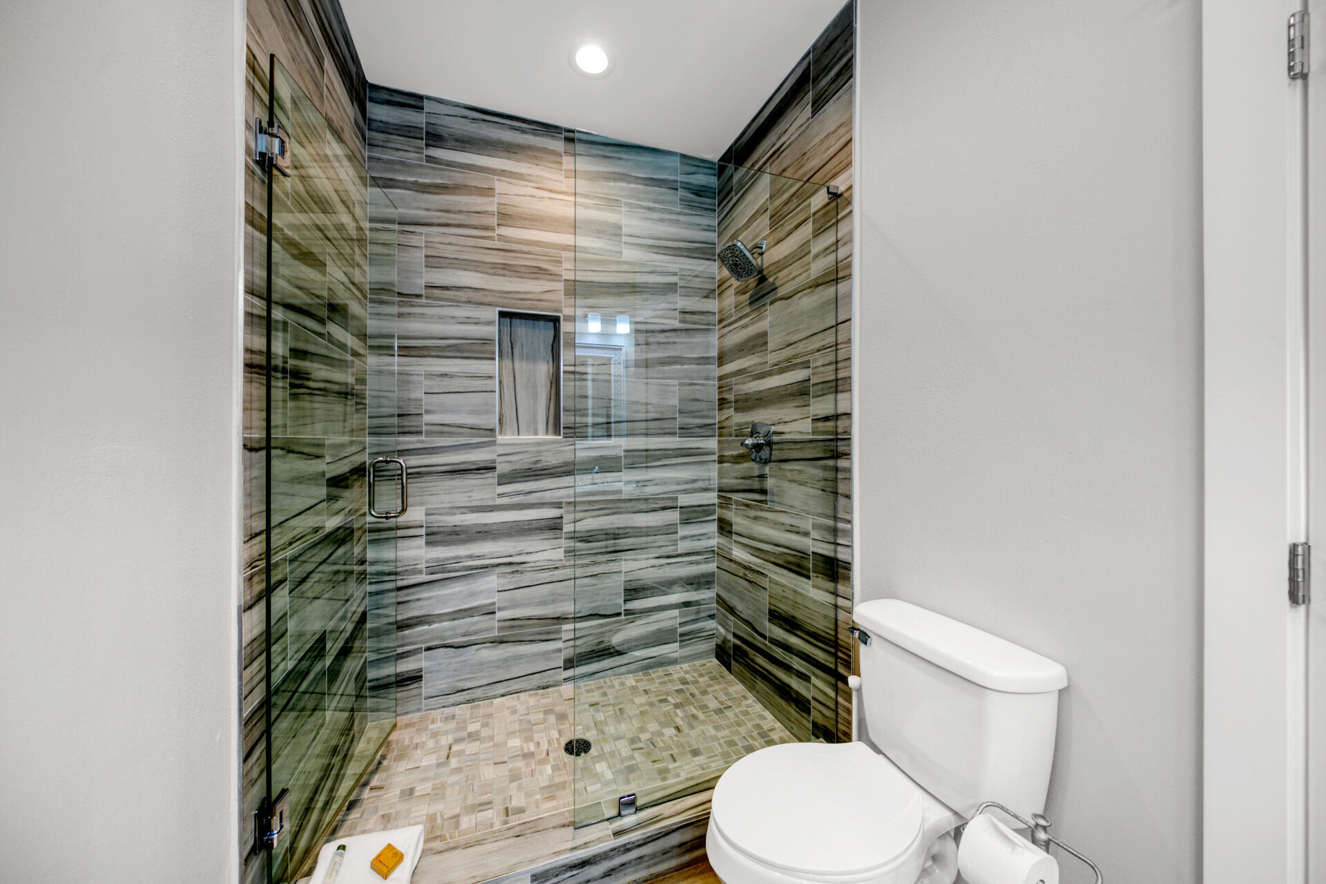 106 Shirah Street Destin, FL 32541 - Photo 16 of 67 a bathroom with a toilet and a shower curtain