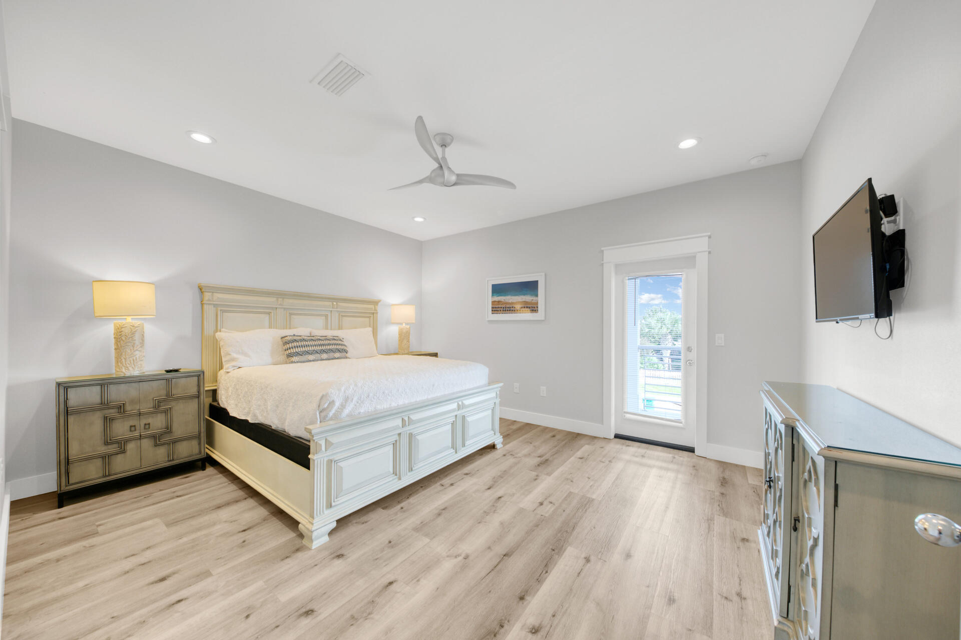 106 Shirah Street Destin, FL 32541 - Photo 17 of 67 a bedroom with a bed and a flat screen tv