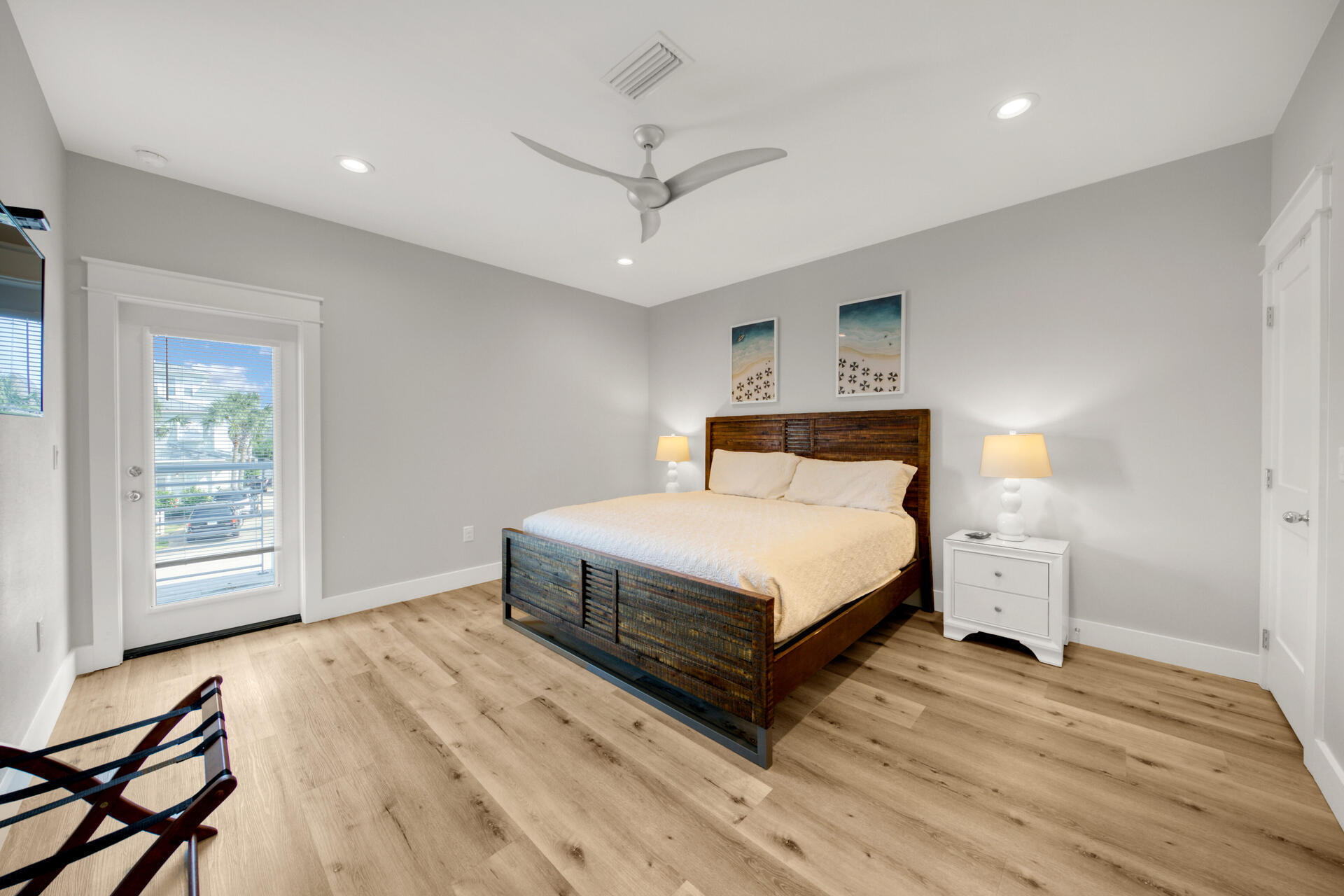 106 Shirah Street Destin, FL 32541 - Photo 21 of 67 a bedroom with a bed and wooden floor