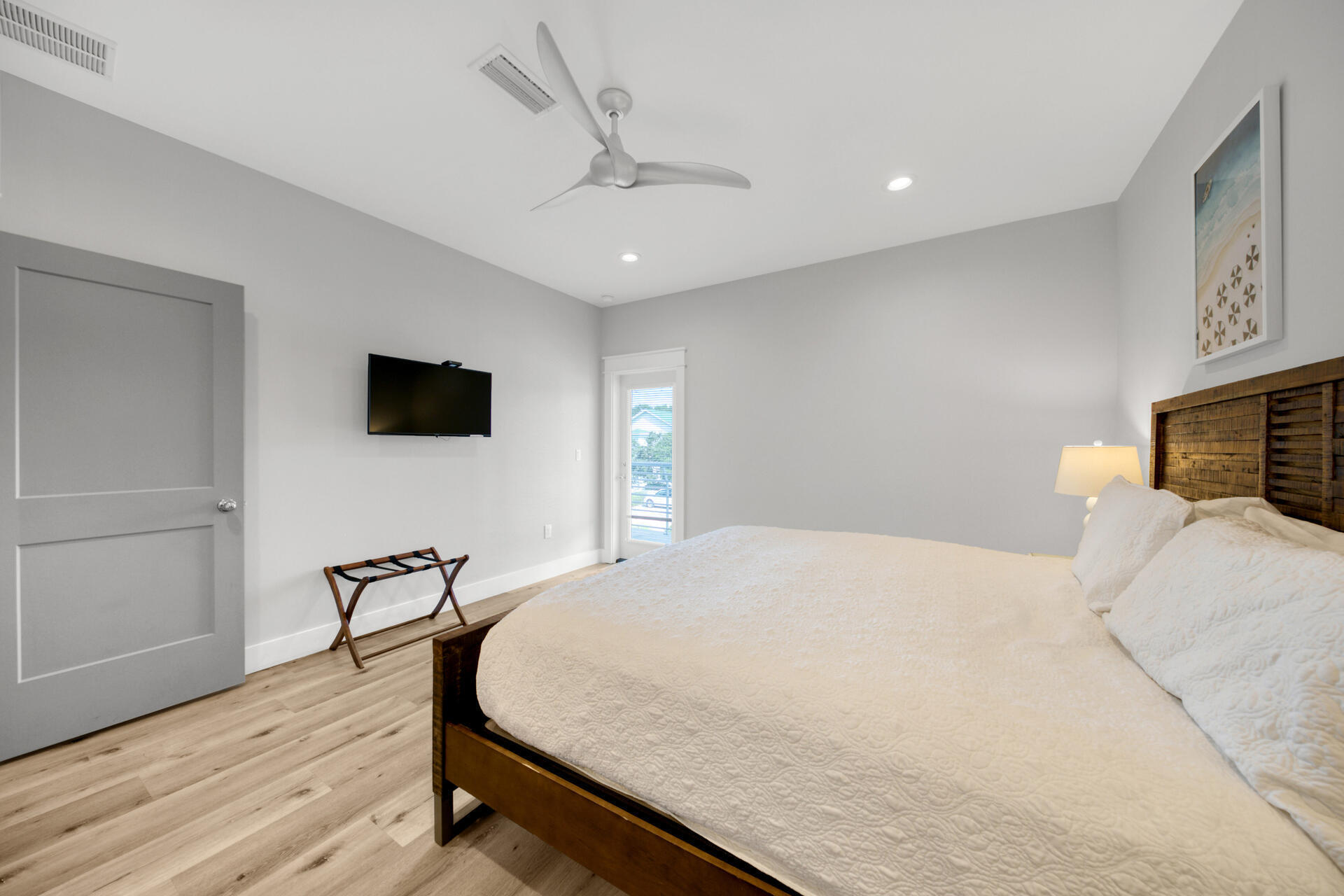 106 Shirah Street Destin, FL 32541 - Photo 22 of 67 a bedroom with a bed and a flat screen tv