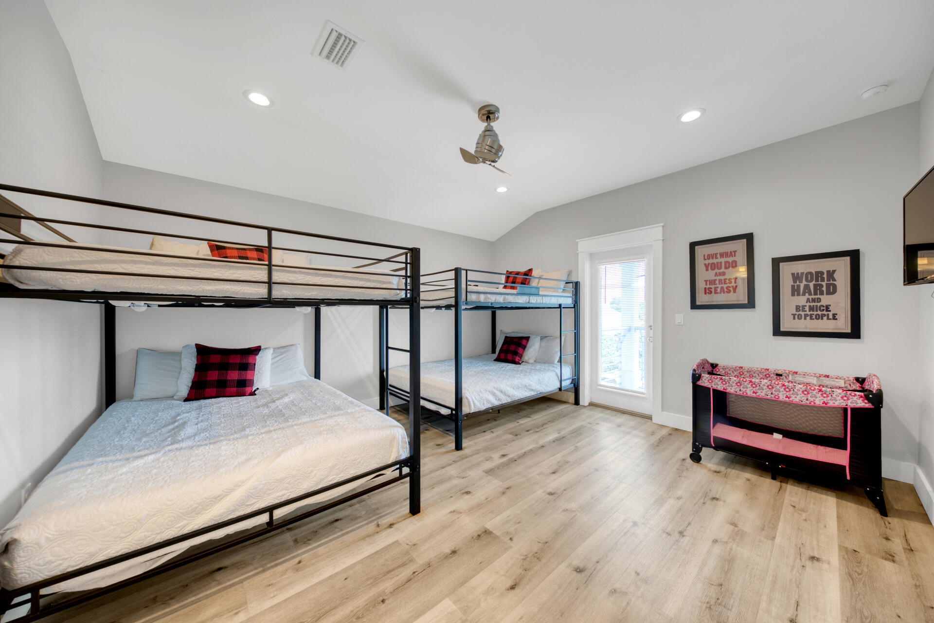 106 Shirah Street Destin, FL 32541 - Photo 32 of 67 a bedroom with bed and a chandelier