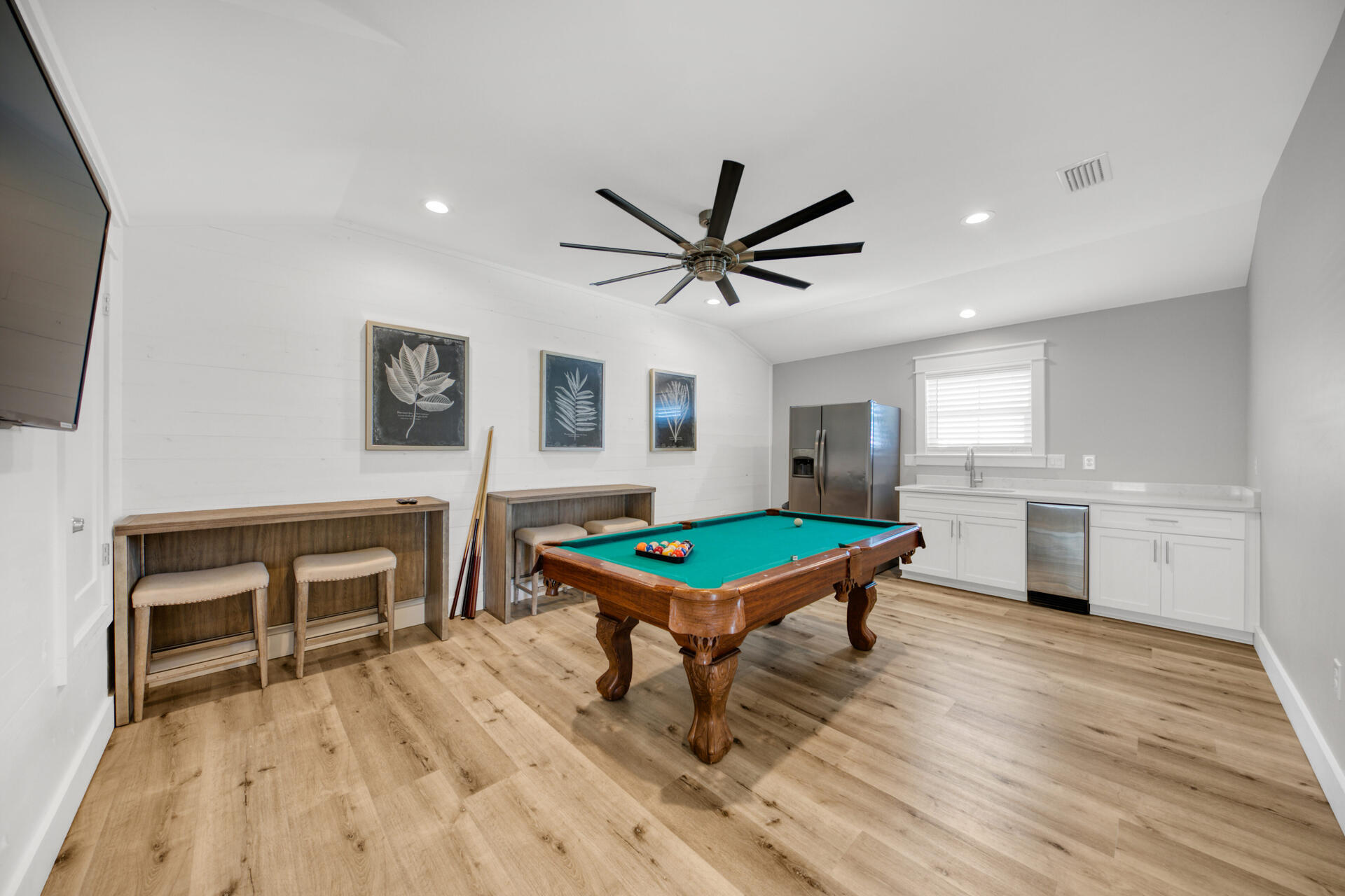 106 Shirah Street Destin, FL 32541 - Photo 36 of 67 a room with furniture pool table wooden floor and a ceiling fan