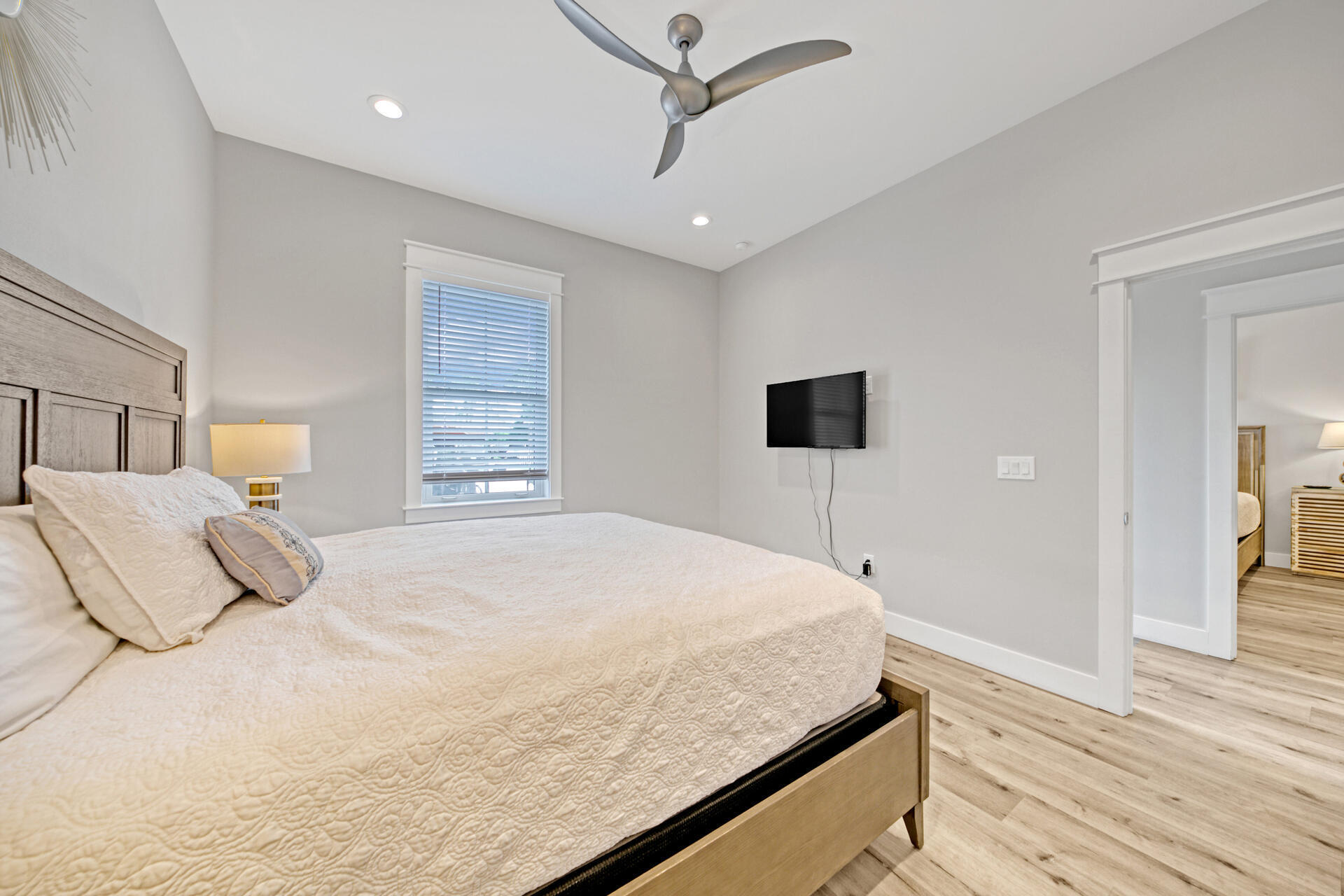 106 Shirah Street Destin, FL 32541 - Photo 40 of 67 a bedroom with a bed and a flat screen tv