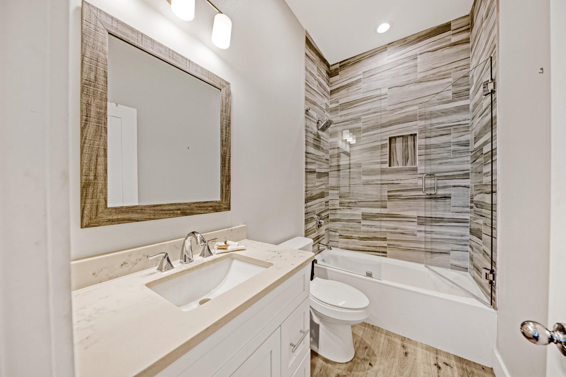 106 Shirah Street Destin, FL 32541 - Photo 41 of 67 a bathroom with a granite countertop toilet sink and mirror