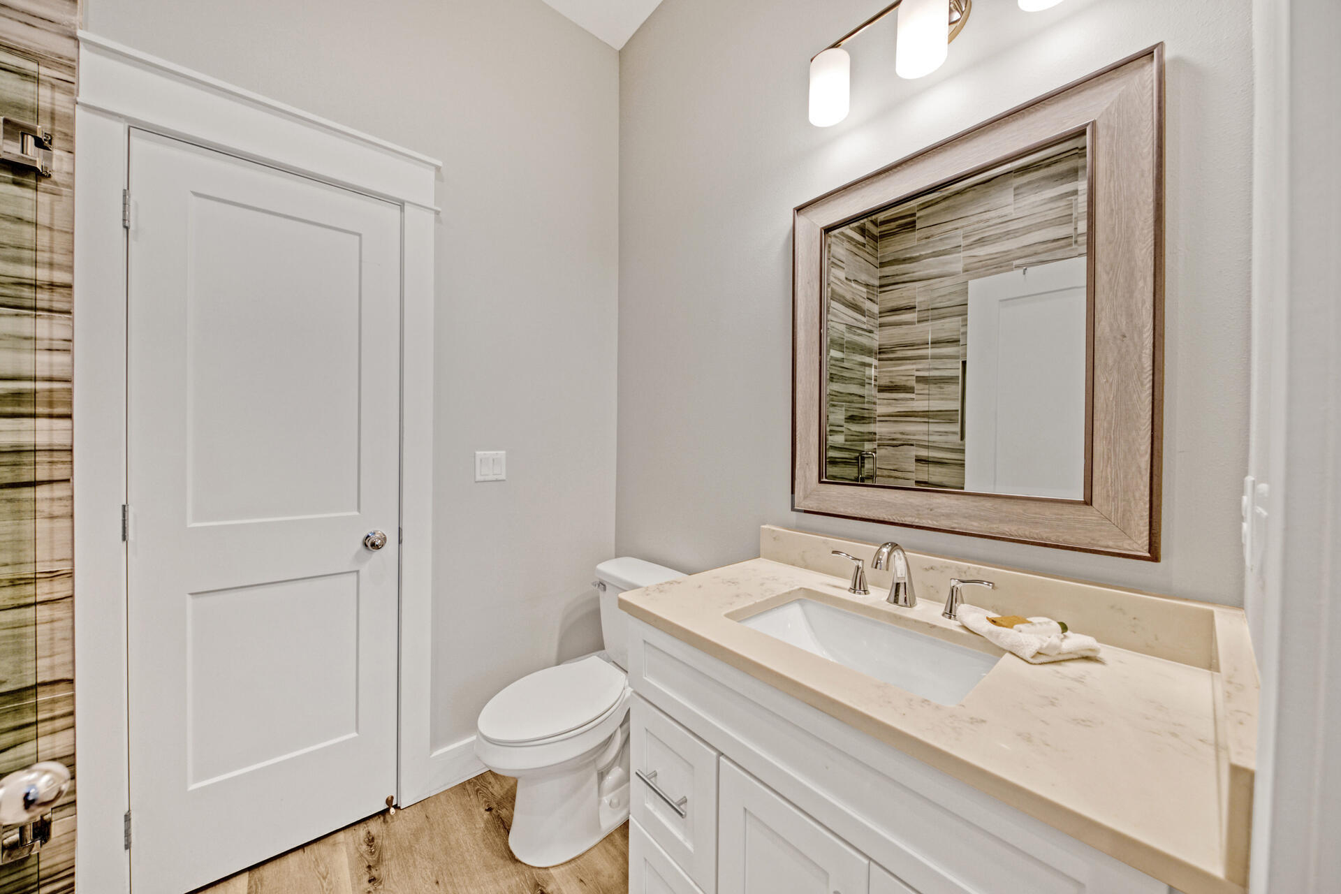 106 Shirah Street Destin, FL 32541 - Photo 44 of 67 a bathroom with a granite countertop sink toilet and shower