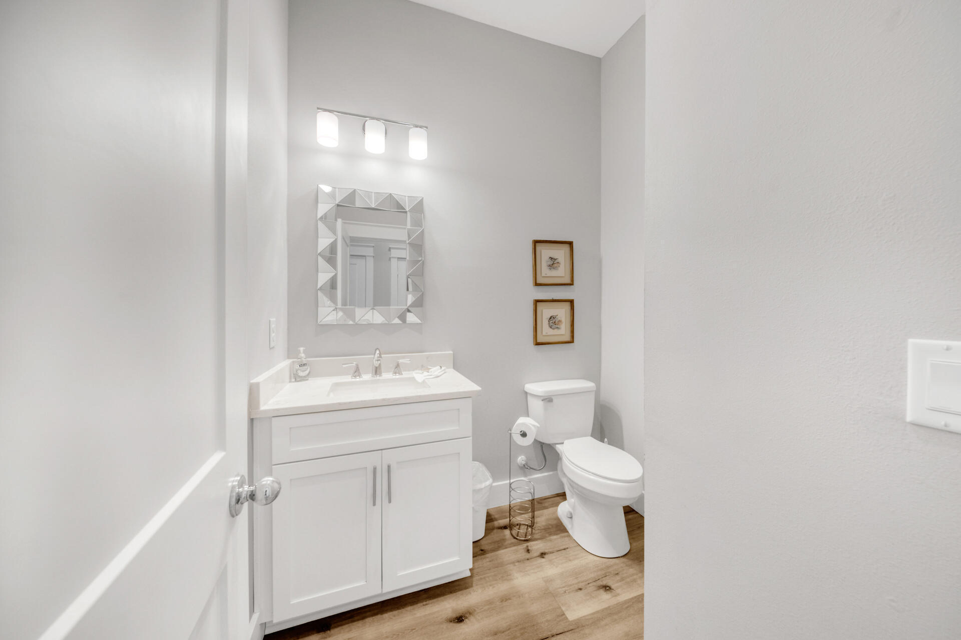 106 Shirah Street Destin, FL 32541 - Photo 48 of 67 a bathroom with a sink a toilet and a mirror