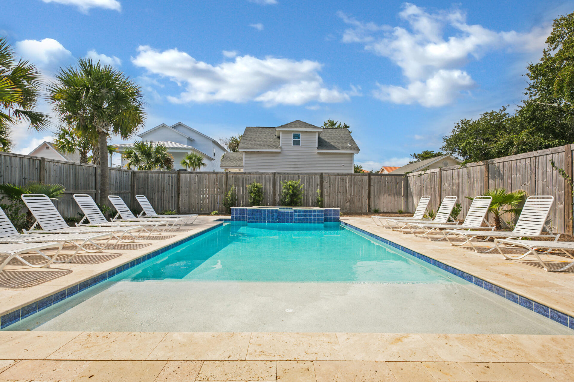 106 Shirah Street Destin, FL 32541 - Photo 58 of 67 a view of a backyard with swimming pool and furniture
