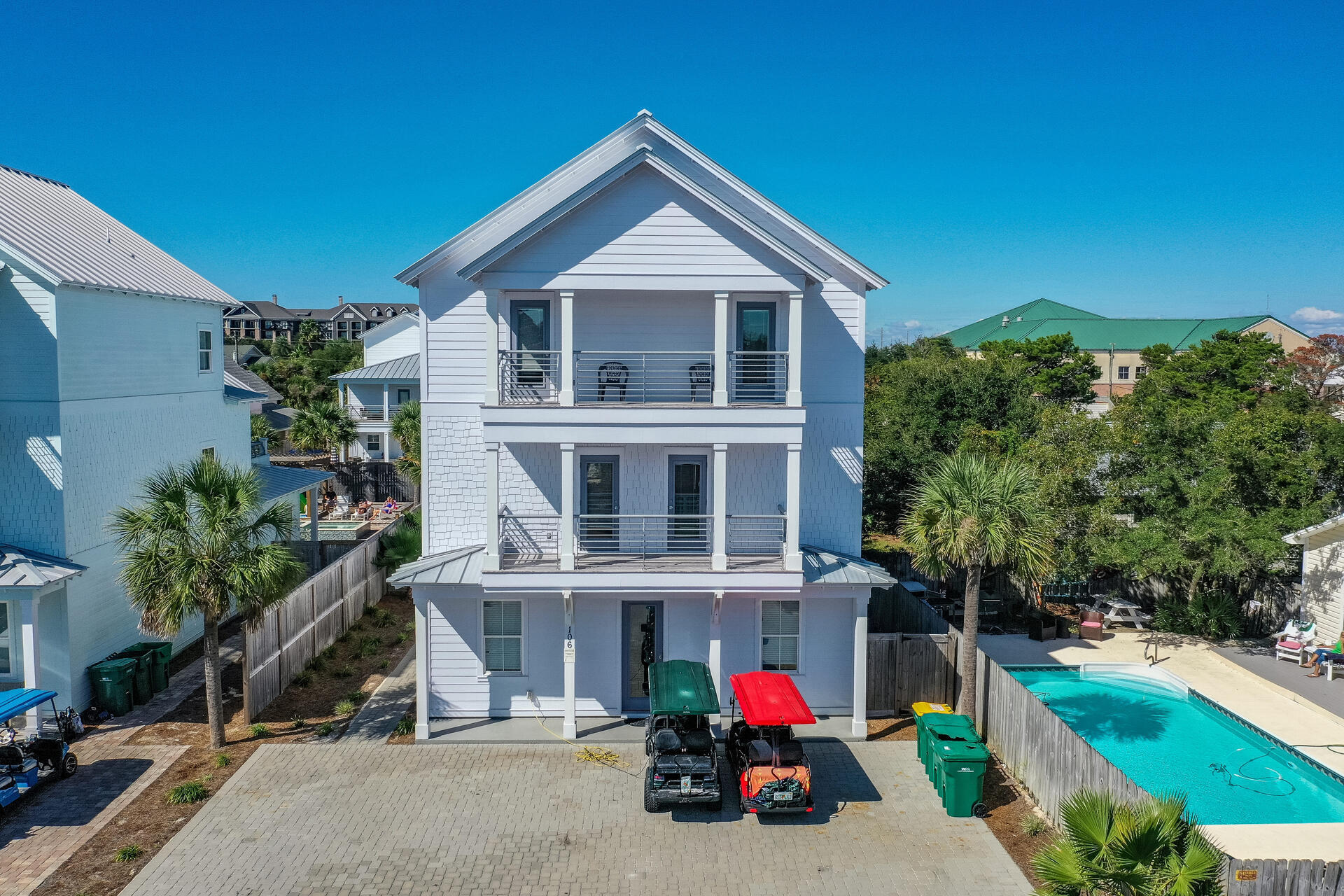 106 Shirah Street Destin, FL 32541 - Photo 63 of 67 a view of a house with a patio and a yard