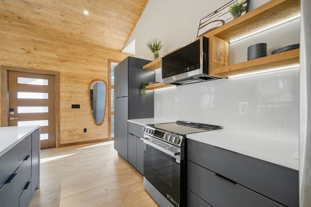 138 Cottonwood Lane Blue Ridge, GA 30513 - Photo 12 of 35 a kitchen with stainless steel appliances granite countertop a stove and a refrigerator