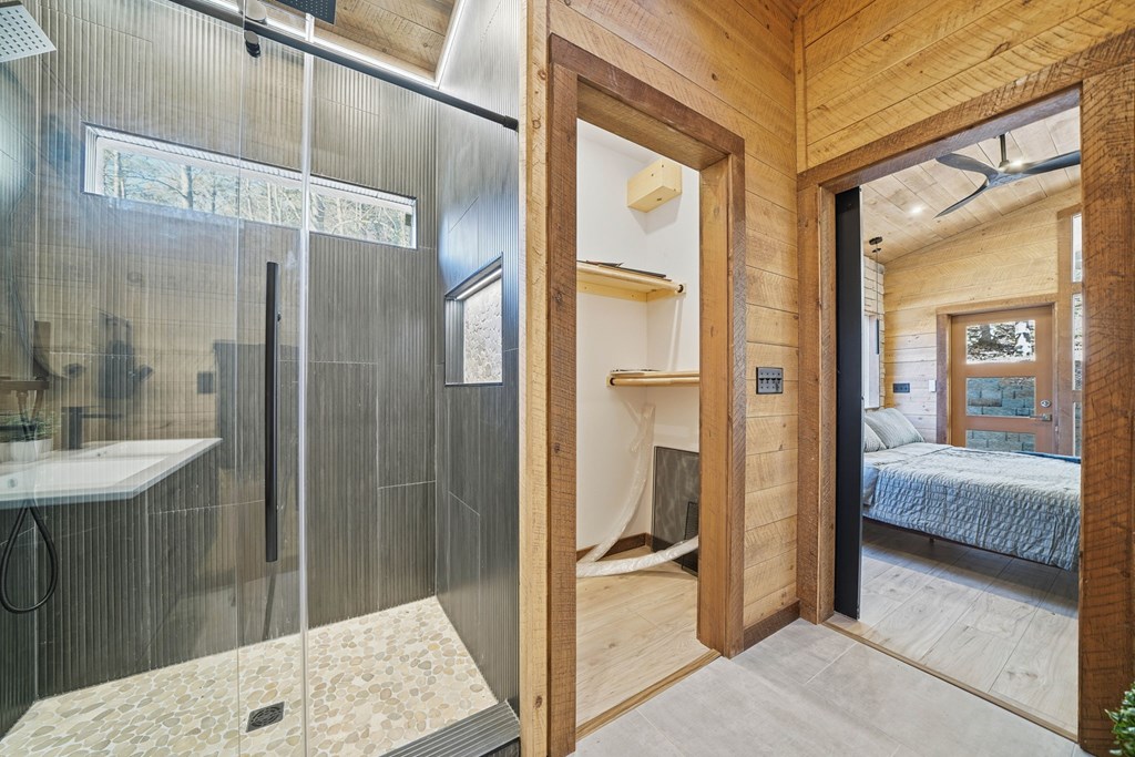 138 Cottonwood Lane Blue Ridge, GA 30513 - Photo 23 of 35 a bathroom with a tub and shower