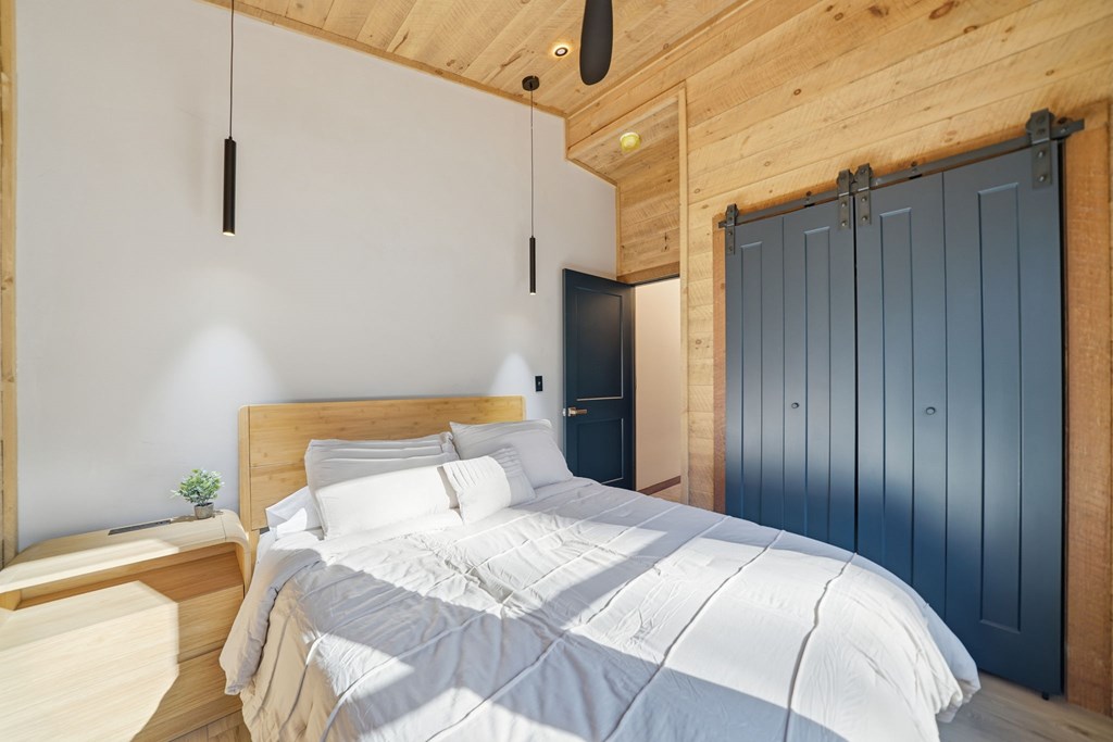 138 Cottonwood Lane Blue Ridge, GA 30513 - Photo 27 of 35 a bedroom with a bed and a dresser