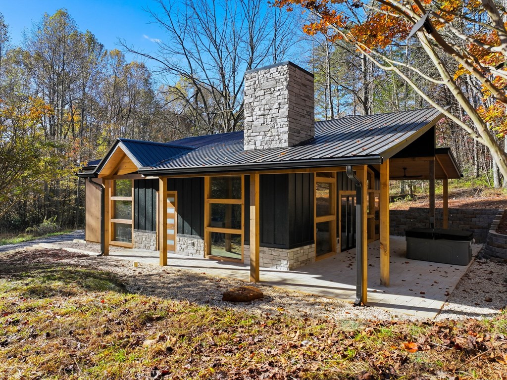 138 Cottonwood Lane Blue Ridge, GA 30513 - Photo 4 of 35 a house with trees in front of it