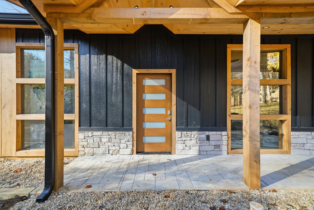 138 Cottonwood Lane Blue Ridge, GA 30513 - Photo 6 of 35 a front view of a house with glass windows