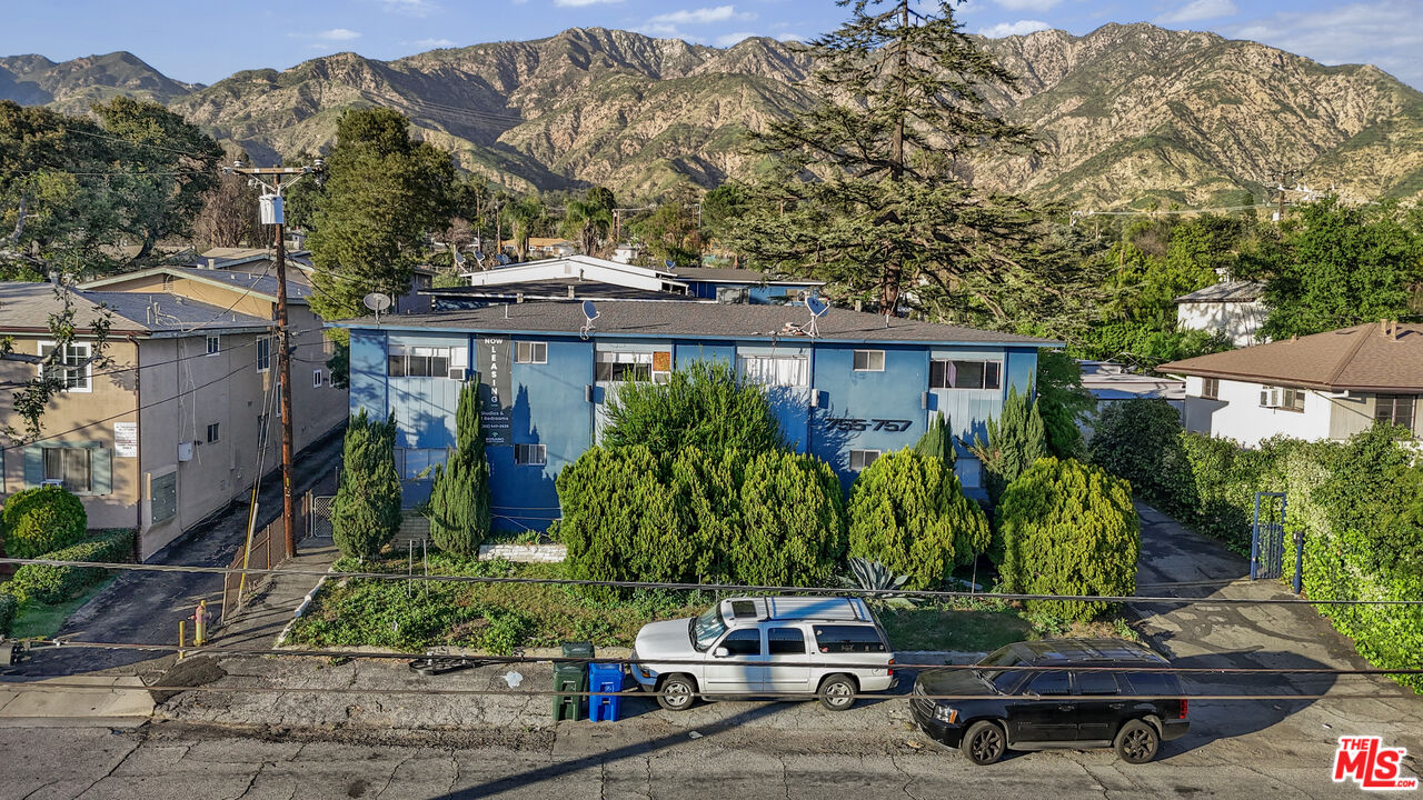 755 East Pine Street Altadena, CA 91001 - Photo 1 of 15 a front view of a house with a yard