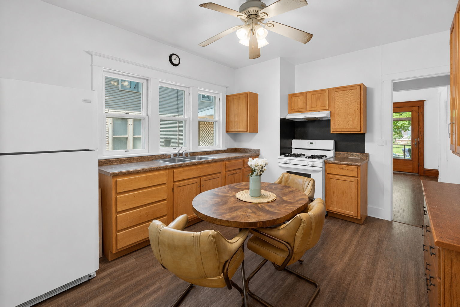 226 West Locust Street DeKalb, IL 60115 - Photo 13 of 40 a dinning room with stainless steel appliances kitchen island granite countertop furniture and a kitchen view