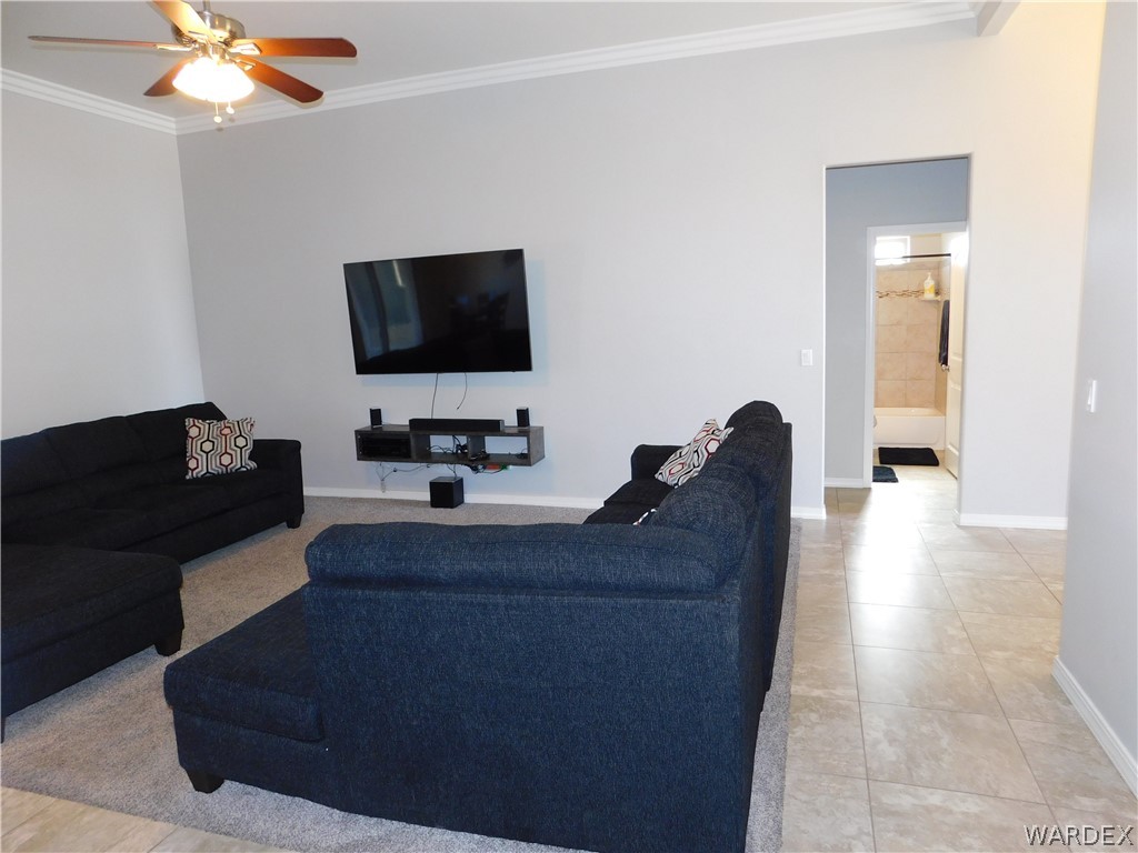 3370 South Ridge Avenue Bullhead City, AZ 86429 - Photo 25 of 56 a living room with furniture and a flat screen tv