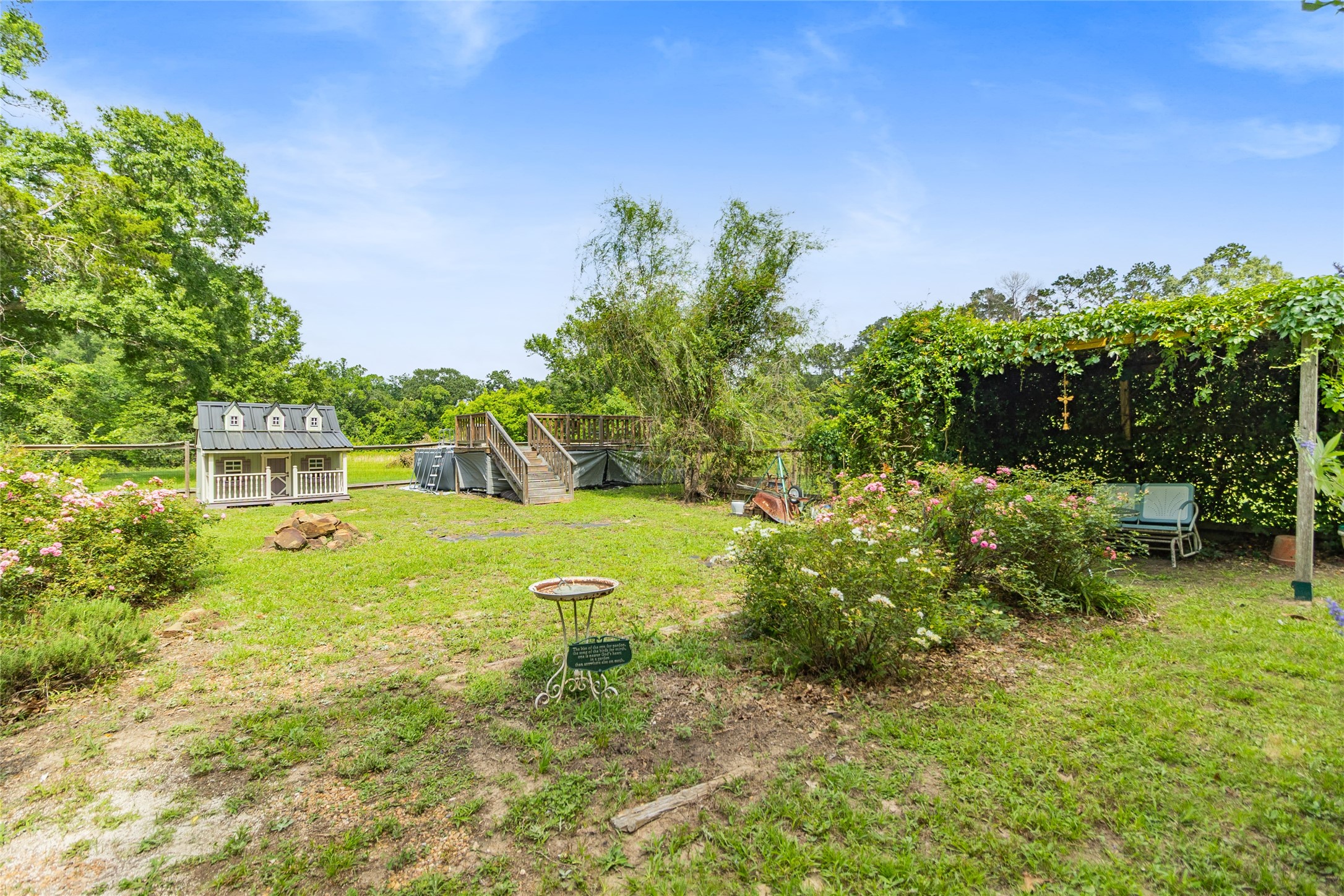 17821 Brown Road Conroe, TX 77306 - Photo 38 of 50 a view of a garden with a fountain