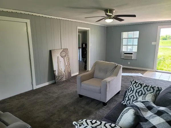 a living room with furniture and a window