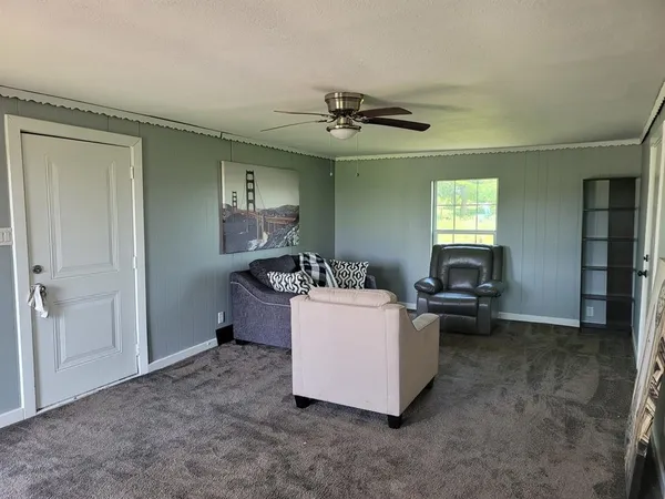 a kitchen with a sink a refrigerator and window