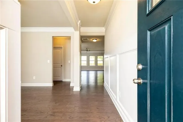 a view of gallery with wooden floor