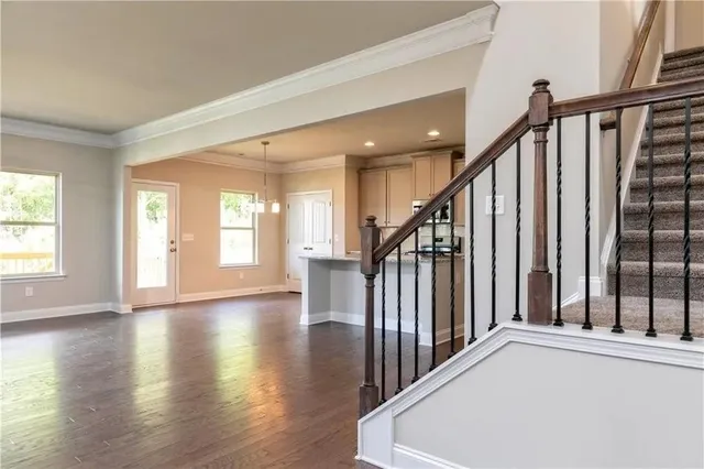a view of an entryway with wooden floor