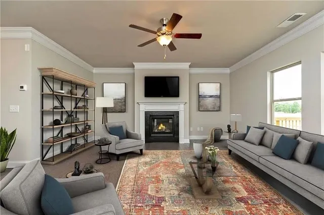 a living room with furniture a fireplace and a flat screen tv