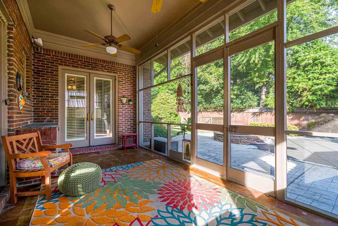 4402 Tuckahoe Road Memphis, TN 38117 - Photo 22 of 25 a bedroom with furniture and large windows