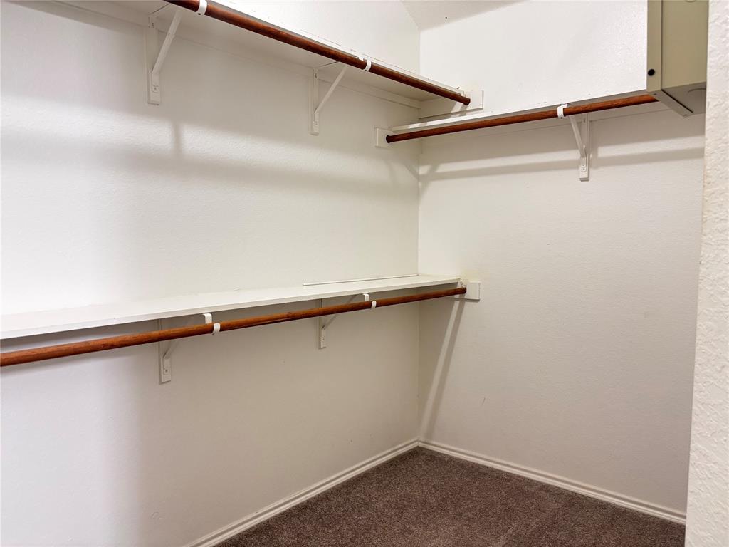 9704 Mystic Dunes Drive McKinney, TX 75072 - Photo 14 of 17 a close up view of racks on the wall