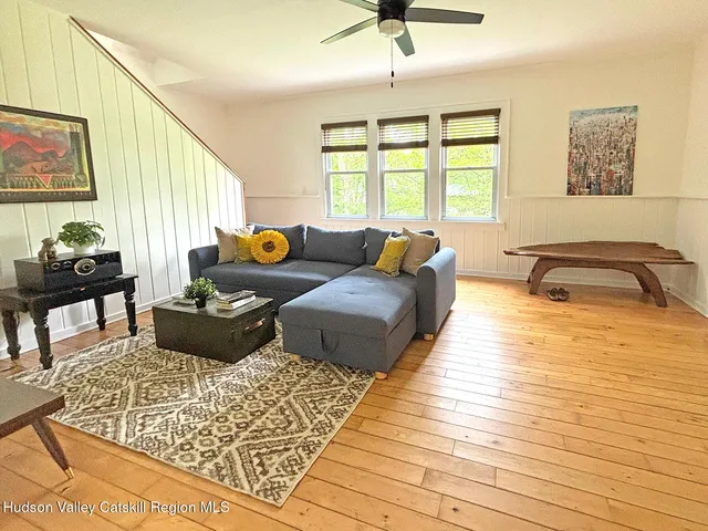 a living room with furniture and a window