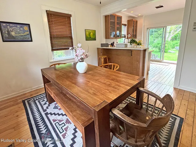 a view of a dining room with furniture window and outside view