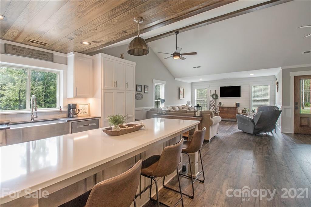 10685 Fink Road Mount Pleasant, NC 28124 - Photo 14 of 41 a view of a dining room with furniture window and wooden floor