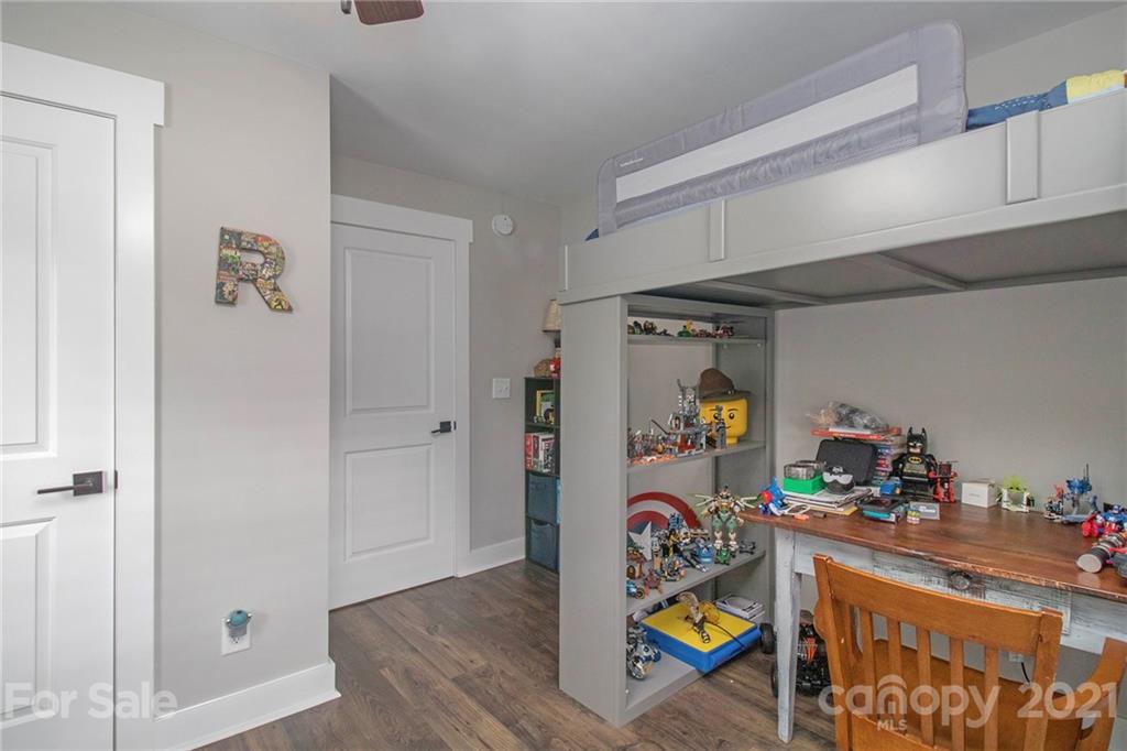 10685 Fink Road Mount Pleasant, NC 28124 - Photo 22 of 41 a view of a hallway with dining room and wooden floor