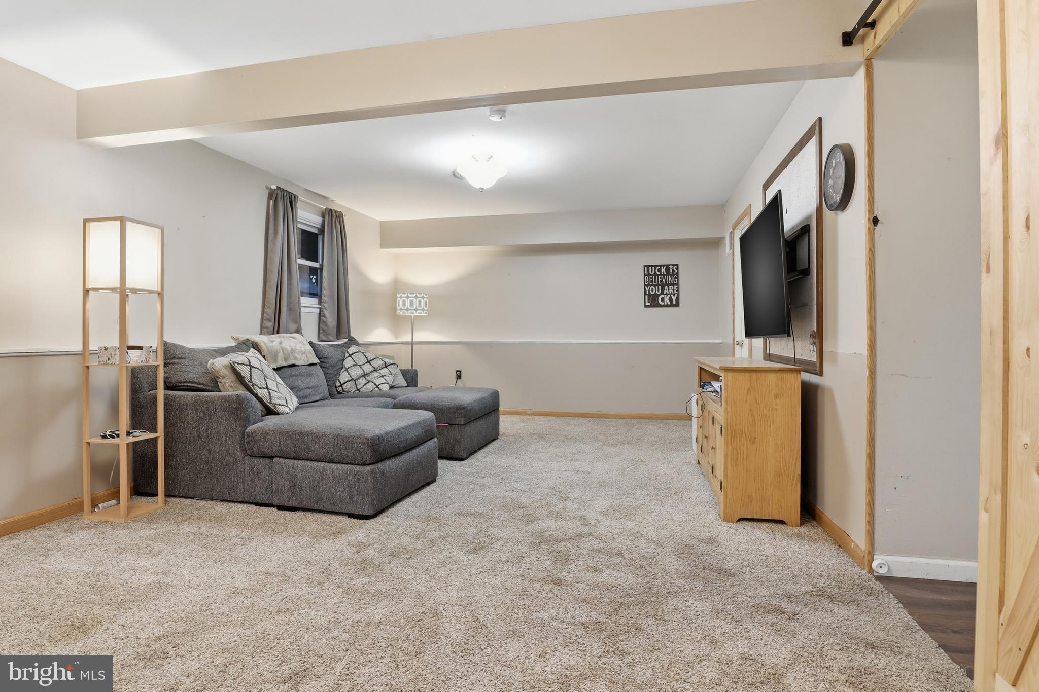 534 Heffner Road Red Lion, PA 17356 - Photo 25 of 51 a living room with furniture and a flat screen tv