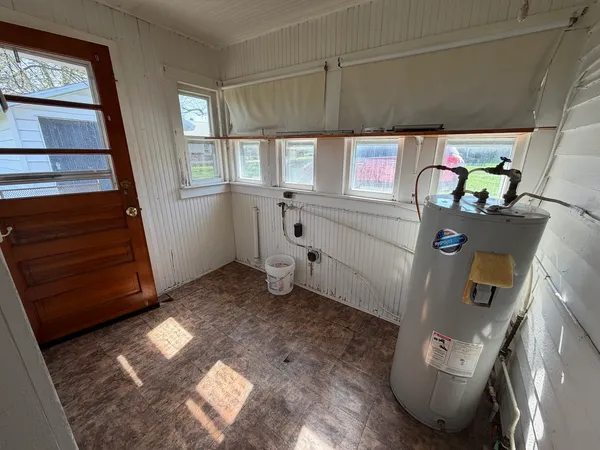 a bathroom with a sink a toilet a shower and a mirror