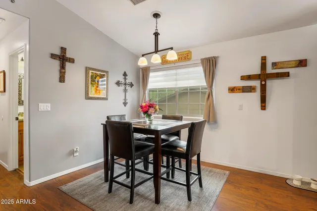 a dining room with furniture and window