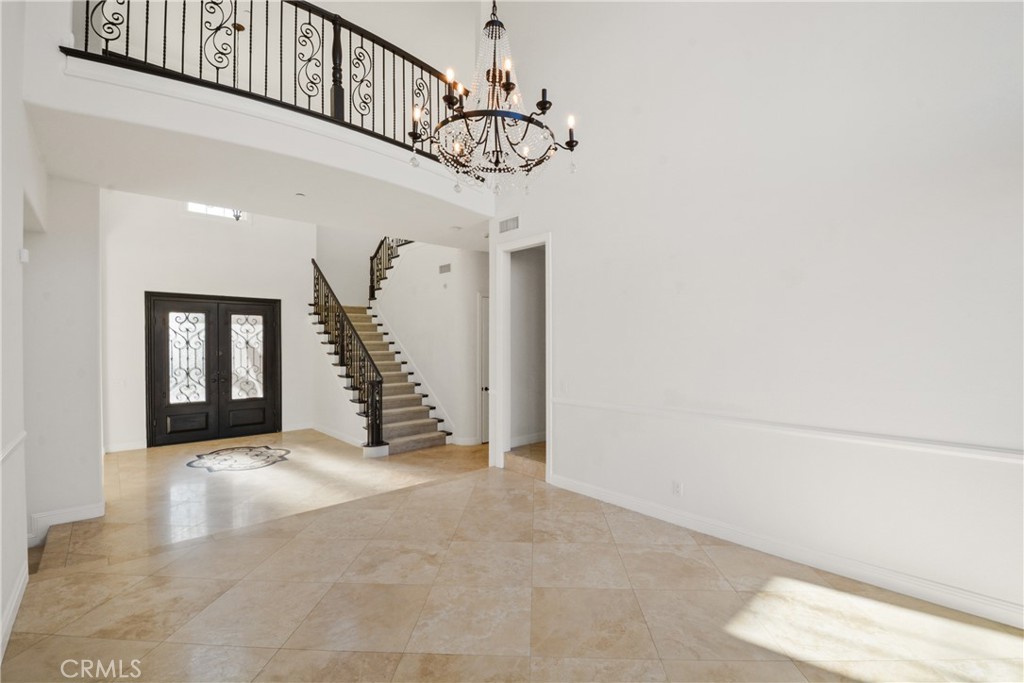 4925 Lone Acres Court Rancho Cucamonga, CA 91737 - Photo 13 of 68 a view of an entryway with a chandelier