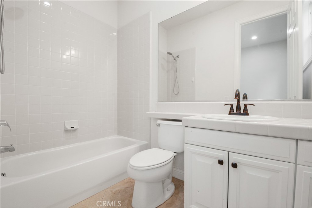 4925 Lone Acres Court Rancho Cucamonga, CA 91737 - Photo 25 of 68 a bathroom with a sink a toilet and shower