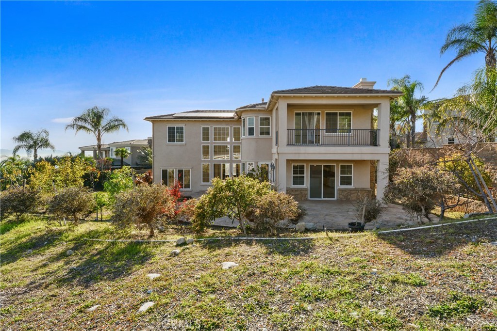 4925 Lone Acres Court Rancho Cucamonga, CA 91737 - Photo 30 of 68 a front view of house with yard and trees in the background