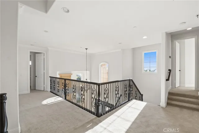 a large white bathroom with a tub shower and sink