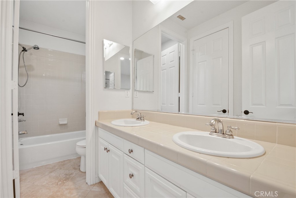4925 Lone Acres Court Rancho Cucamonga, CA 91737 - Photo 49 of 68 a bathroom with a sink double vanity granite tub and shower